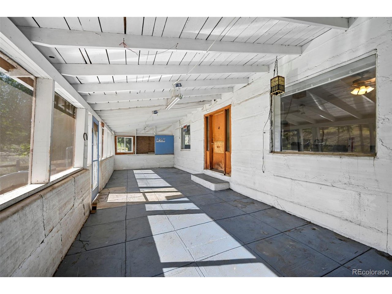 2677 South Platte River Road Sedalia, CO 80135 - Photo 9 of 42 a view of entryway with a window and a glass door