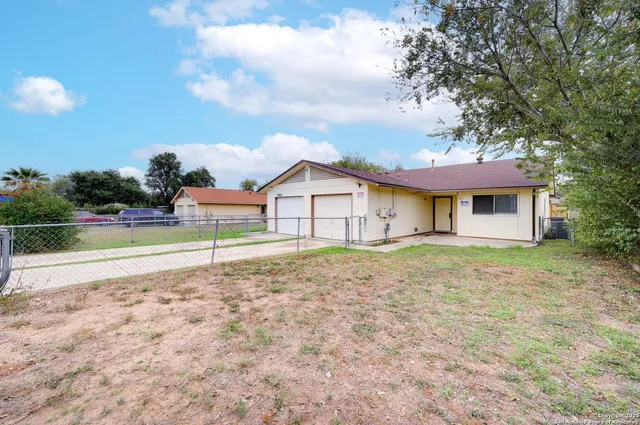a house with trees in the background