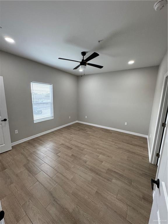 800 Ragland Road, Unit 9 Mission, TX 78572 - Photo 12 of 16 an empty room with windows and fan