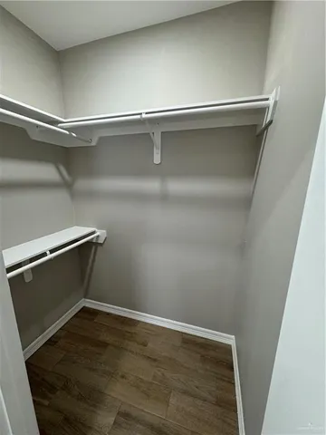 a bathroom with a sink shower and a mirror