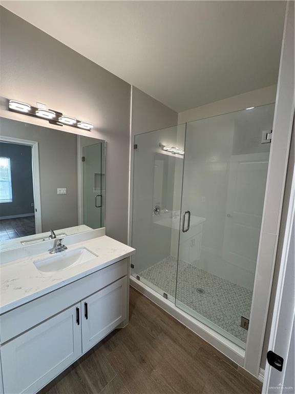 800 Ragland Road, Unit 9 Mission, TX 78572 - Photo 14 of 16 a bathroom with a double vanity sink mirror and shower