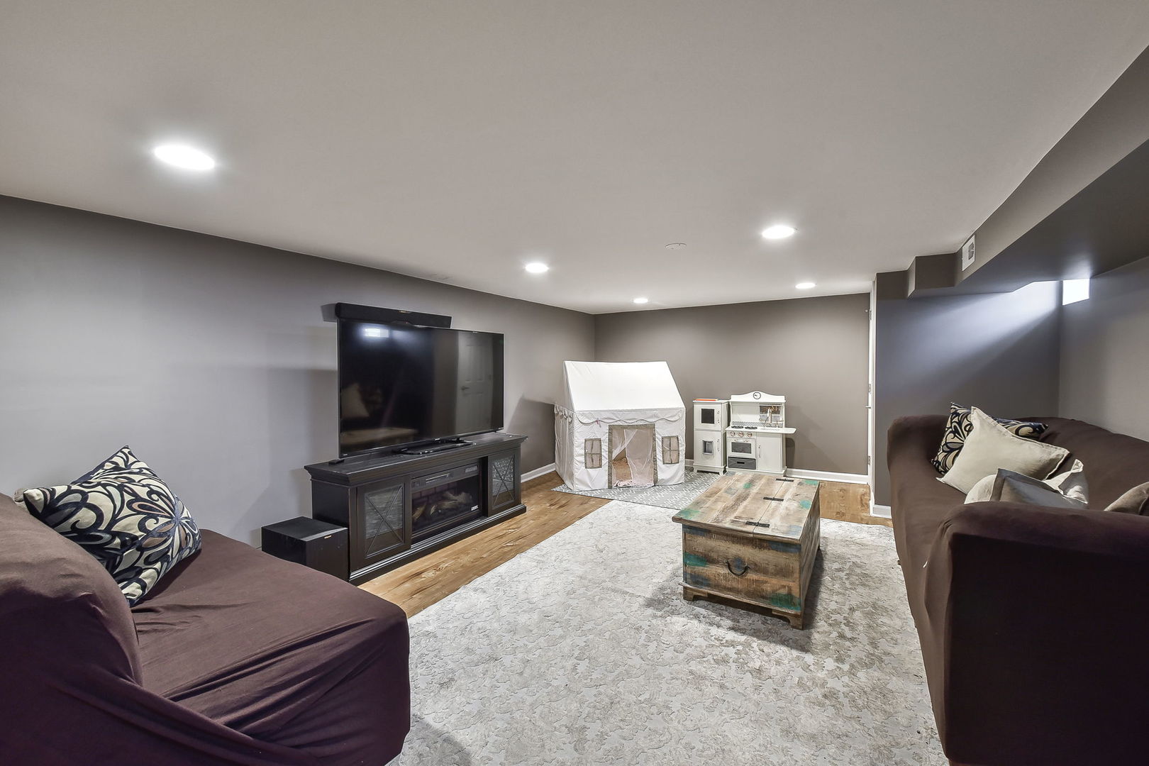 1500 Lee Boulevard Berkeley, IL 60163 - Photo 16 of 22 a living room with furniture and a flat screen tv