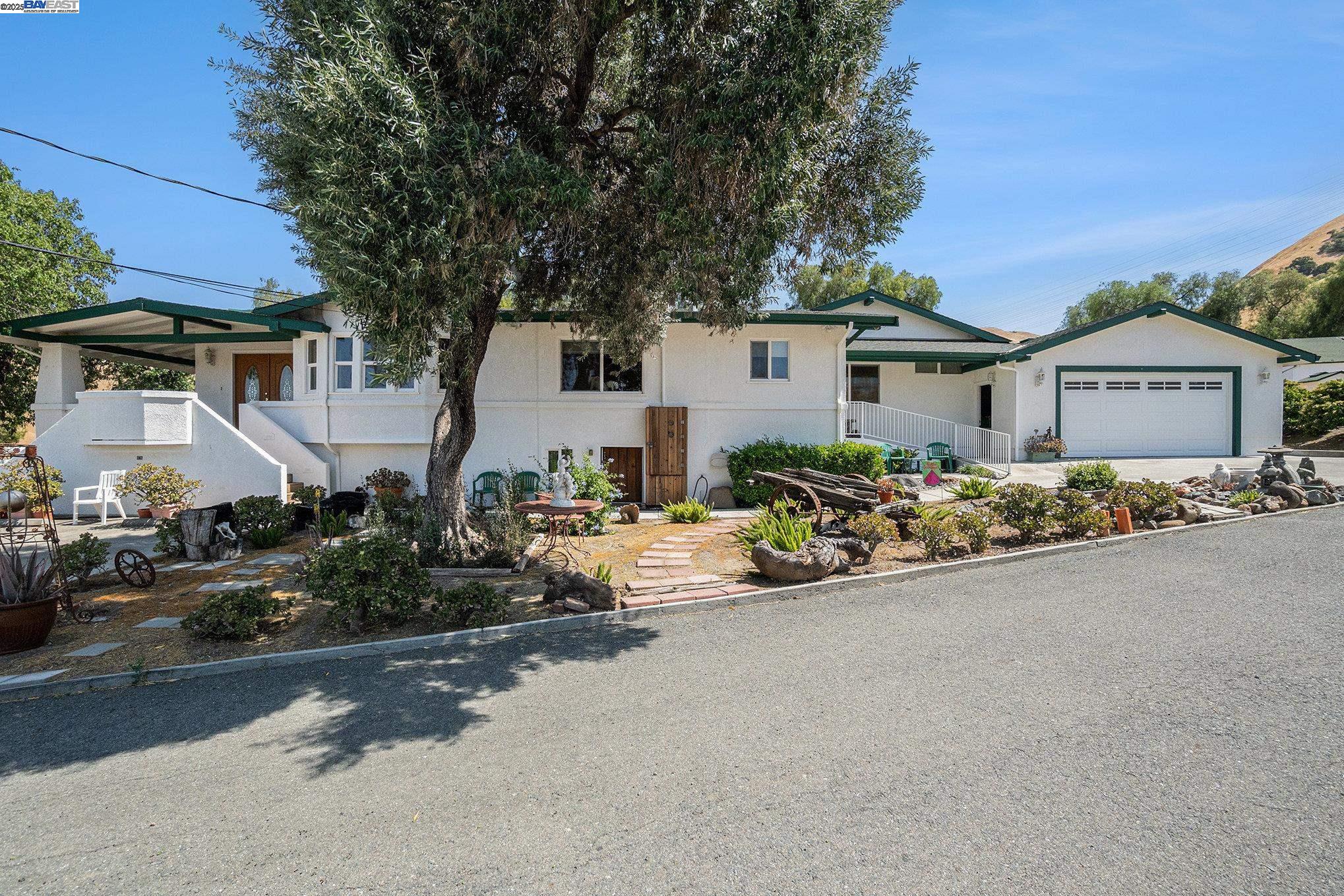 5799 Nortonville Road Pittsburg, CA 94565 - Photo 5 of 59 a front view of a house with sitting area and garden