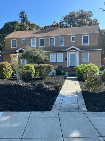 a front view of a house with yard