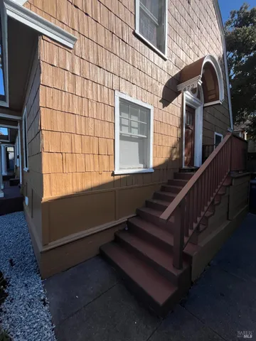 a view of backyard with deck and wooden floor