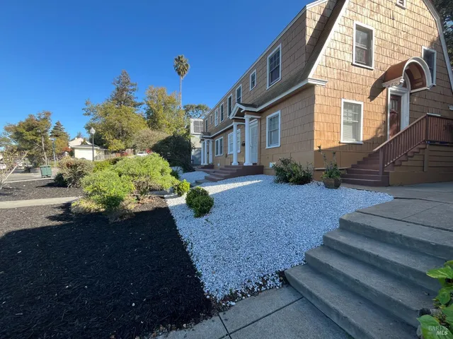 a view of a house with a yard