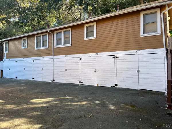 a view of a house with a backyard