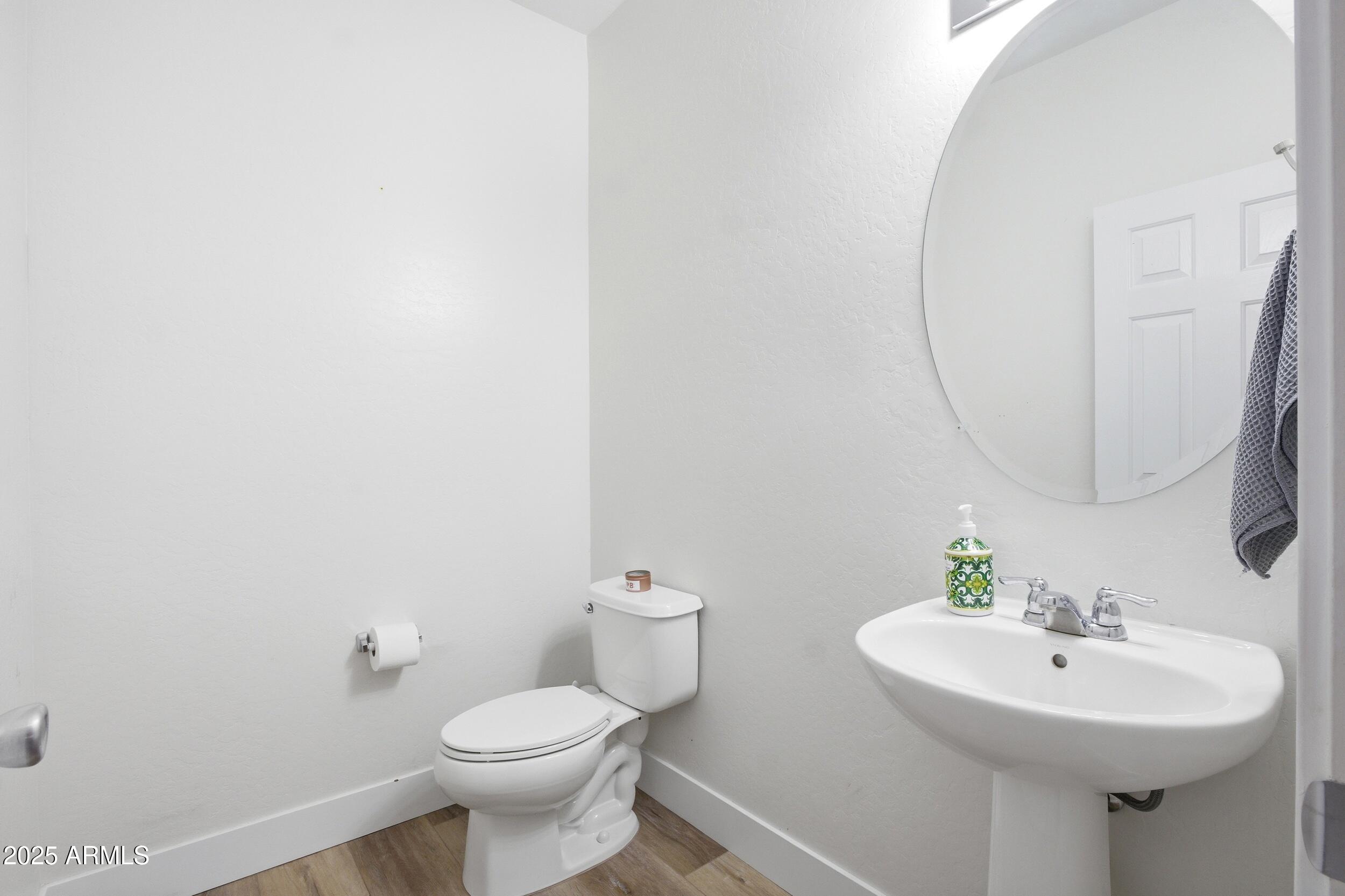 1255 South Rialto, Unit 162 Mesa, AZ 85209 - Photo 12 of 27 a bathroom with a sink toilet and a mirror