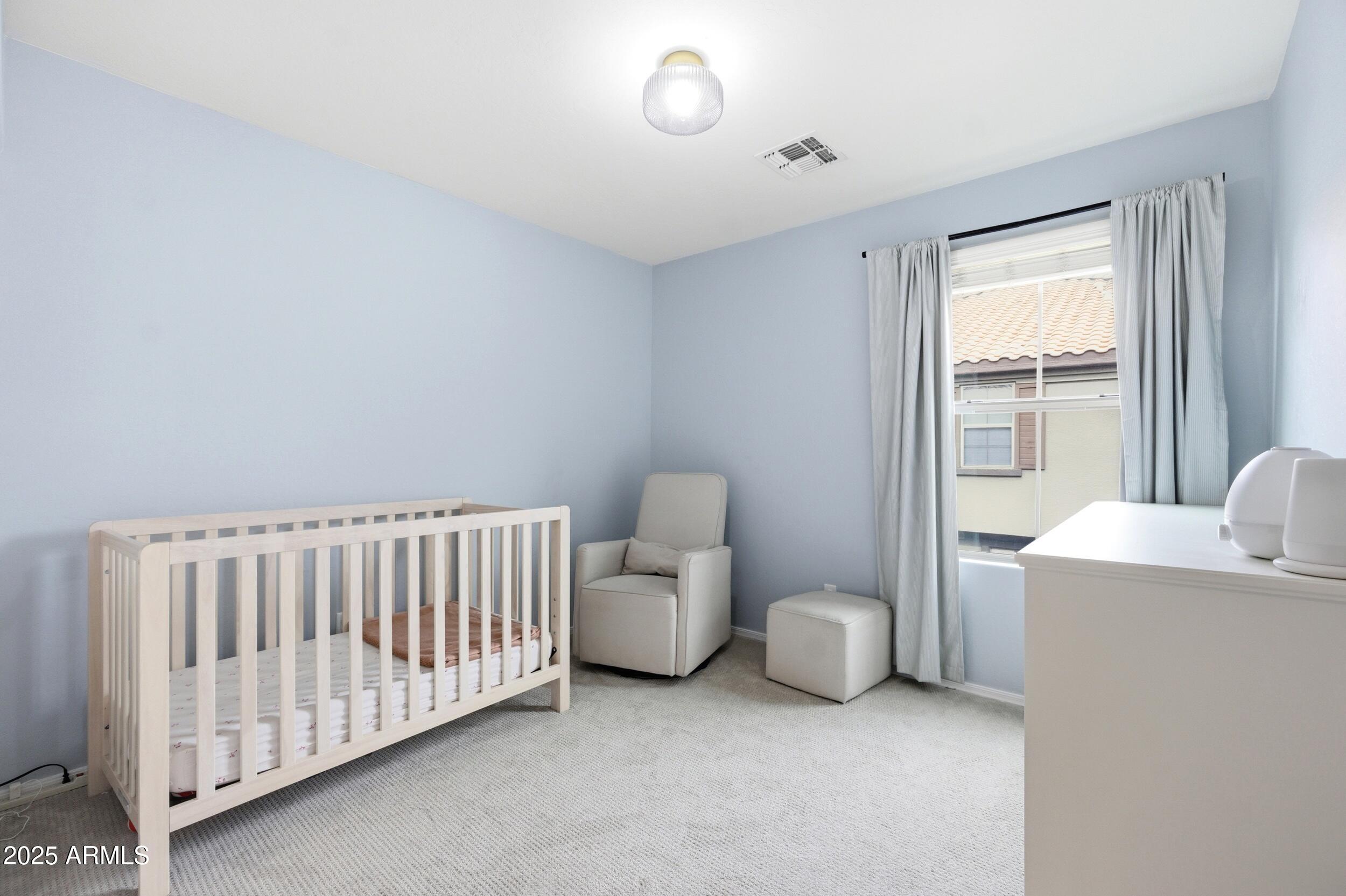 1255 South Rialto, Unit 162 Mesa, AZ 85209 - Photo 16 of 27 a bedroom with furniture and a window