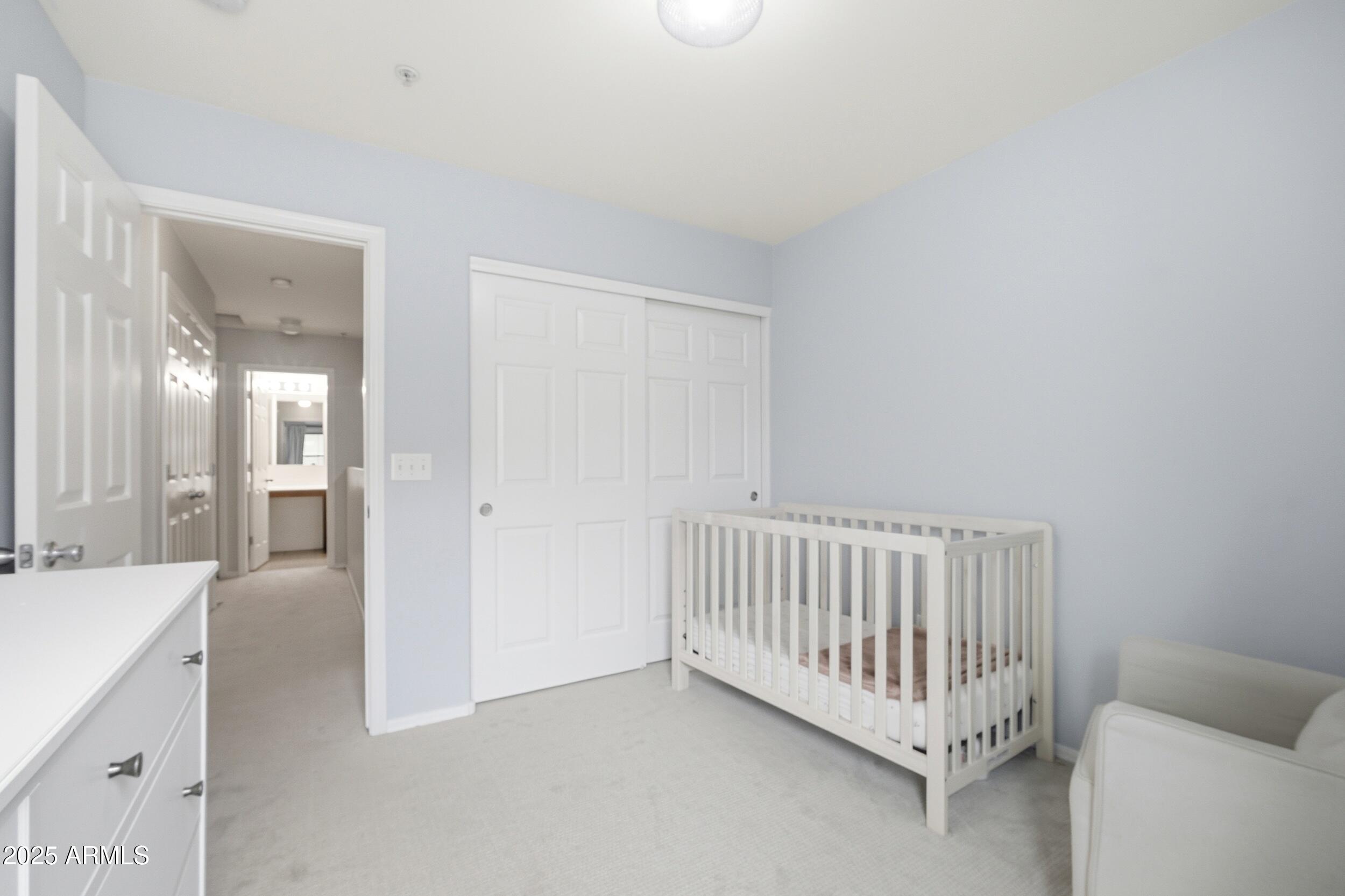 1255 South Rialto, Unit 162 Mesa, AZ 85209 - Photo 17 of 27 a view of a room with a baby crib