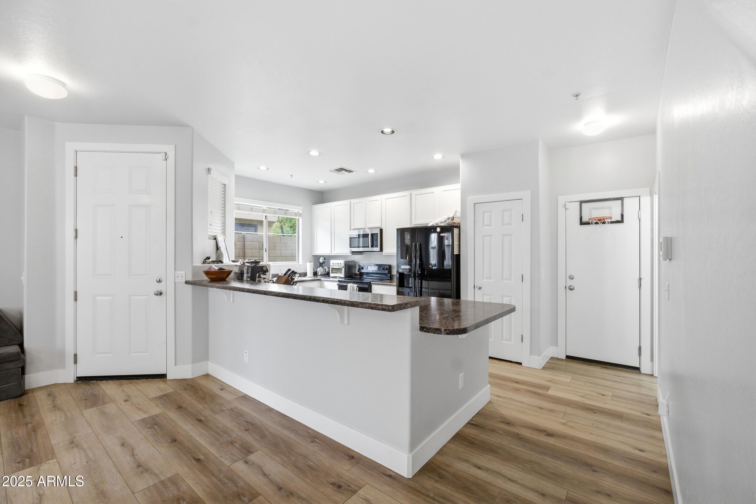 1255 South Rialto, Unit 162 Mesa, AZ 85209 - Photo 2 of 27 a view of kitchen with wooden floor