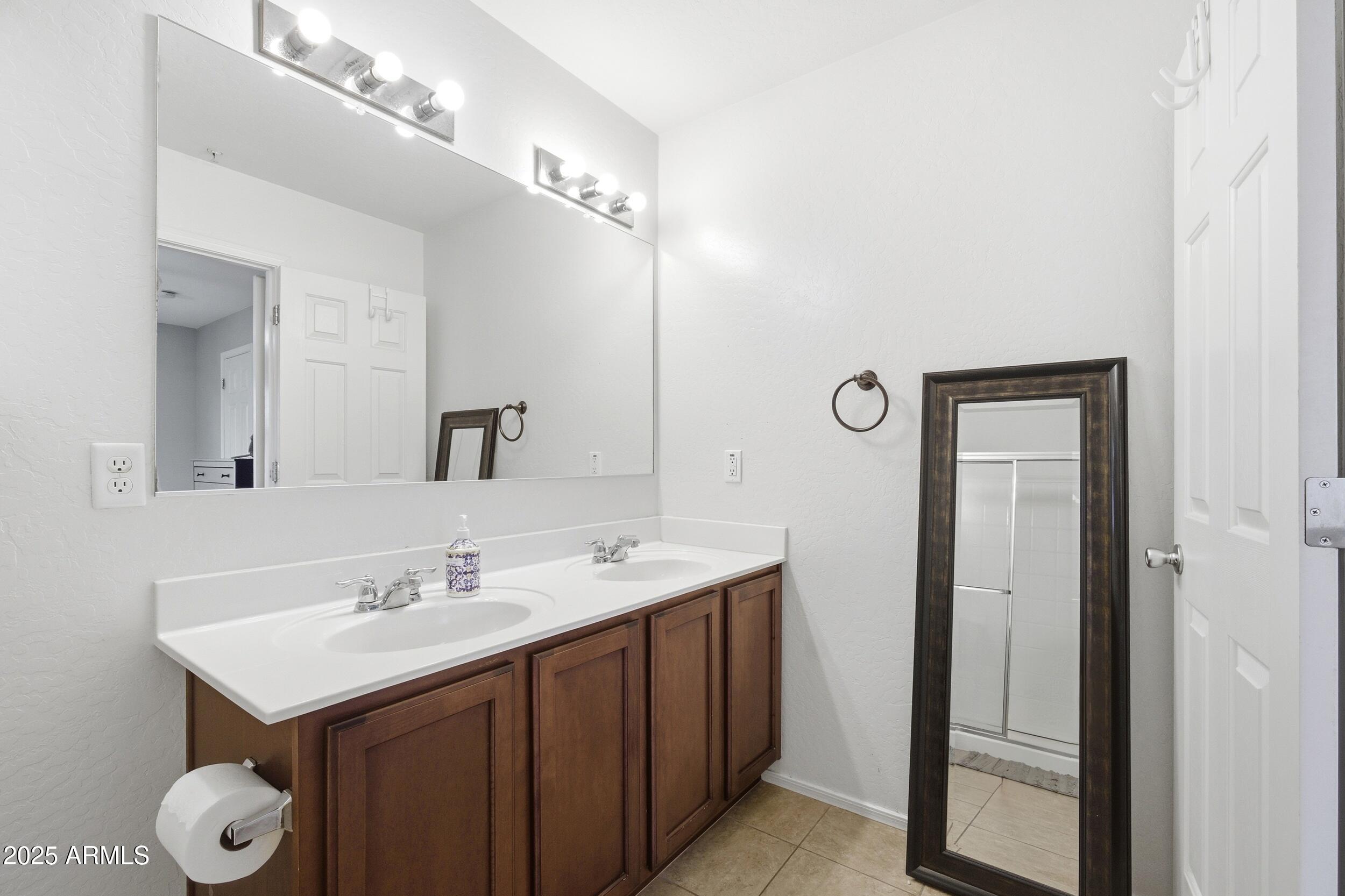 1255 South Rialto, Unit 162 Mesa, AZ 85209 - Photo 21 of 27 a bathroom with a sink and a mirror