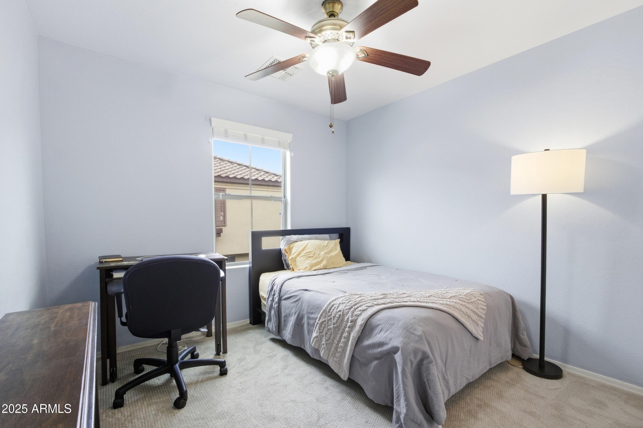 1255 South Rialto, Unit 162 Mesa, AZ 85209 - Photo 23 of 27 a bedroom with a bed and a chair