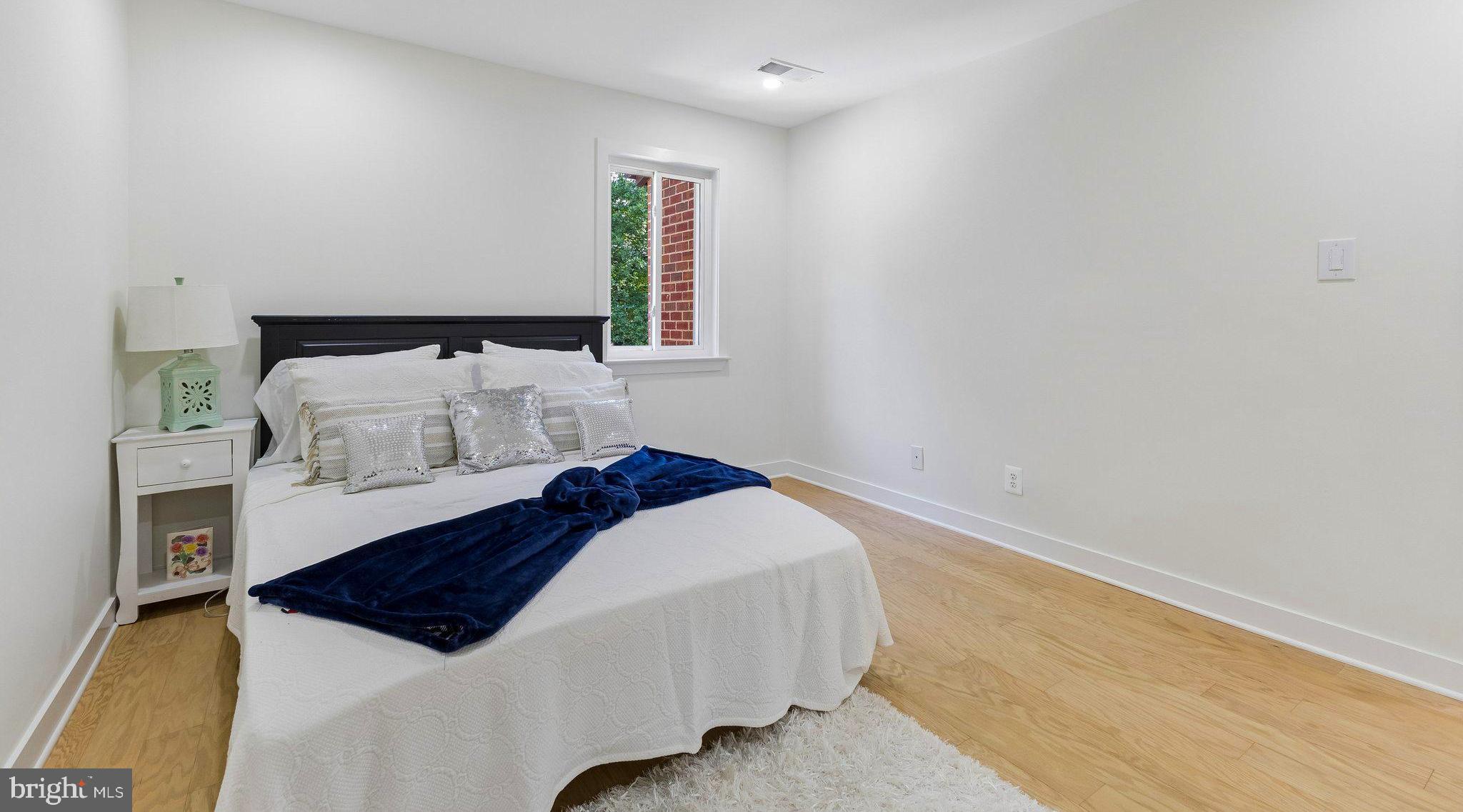 11841 Shire Court, Unit 31D Reston, VA 20191 - Photo 24 of 24 a bedroom with a bed and a couch