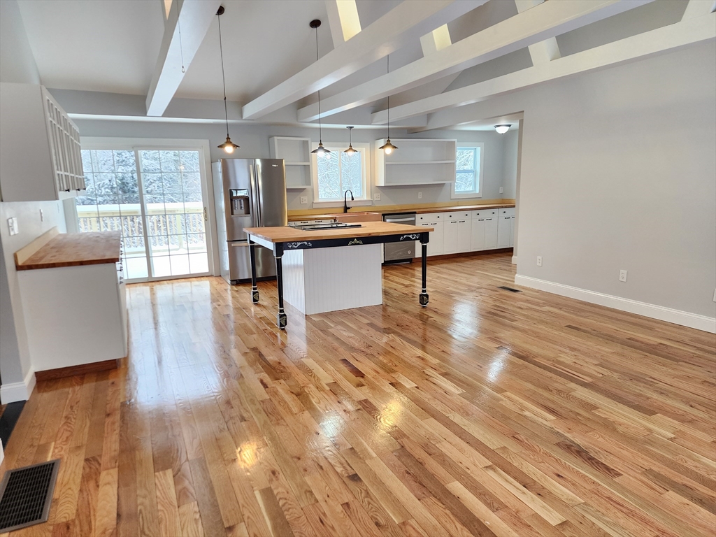 405 Queen Lake Road Phillipston, MA 01331 - Photo 7 of 25 a view of kitchen with sink and wooden floor