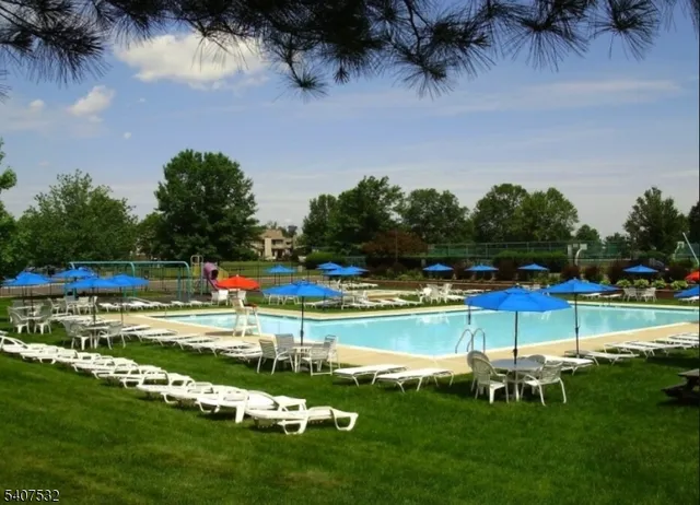 a view of a swimming pool with a yard