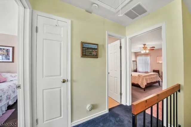a view of a bedroom from a hallway