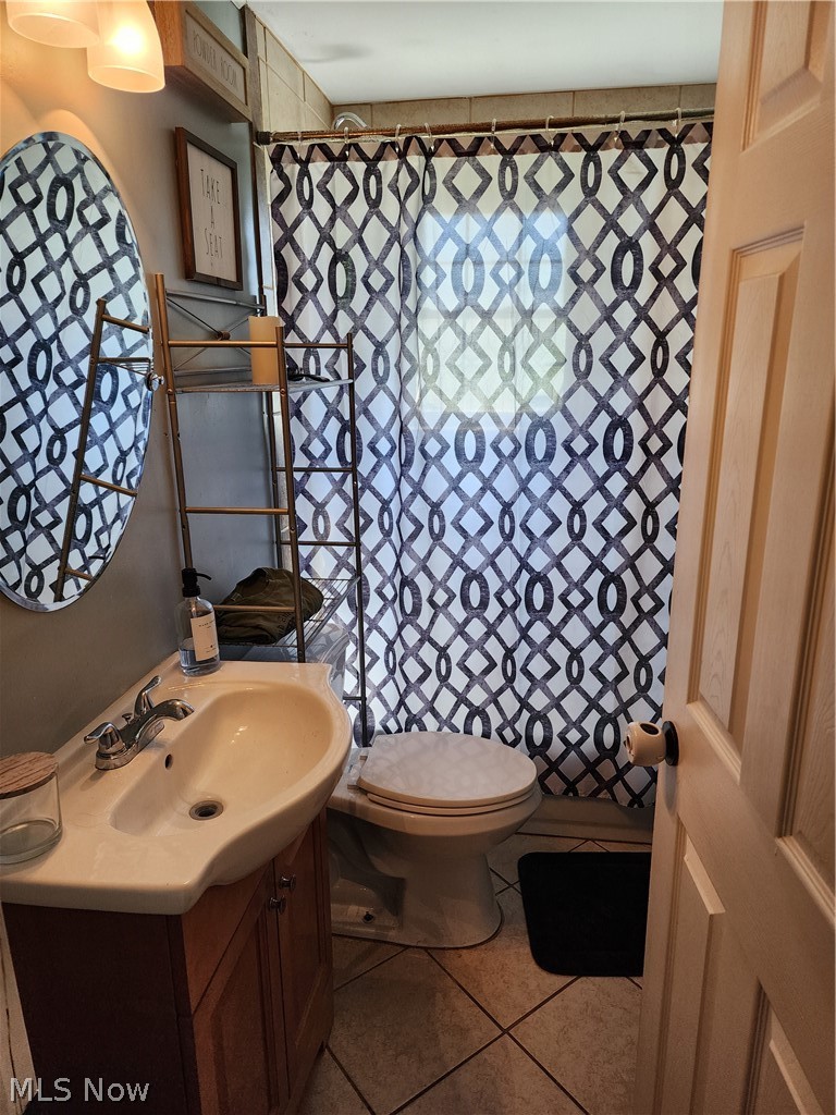 3860 Burkey Road Youngstown, OH 44515 - Photo 14 of 19 Bathroom with toilet, tile flooring, and vanity