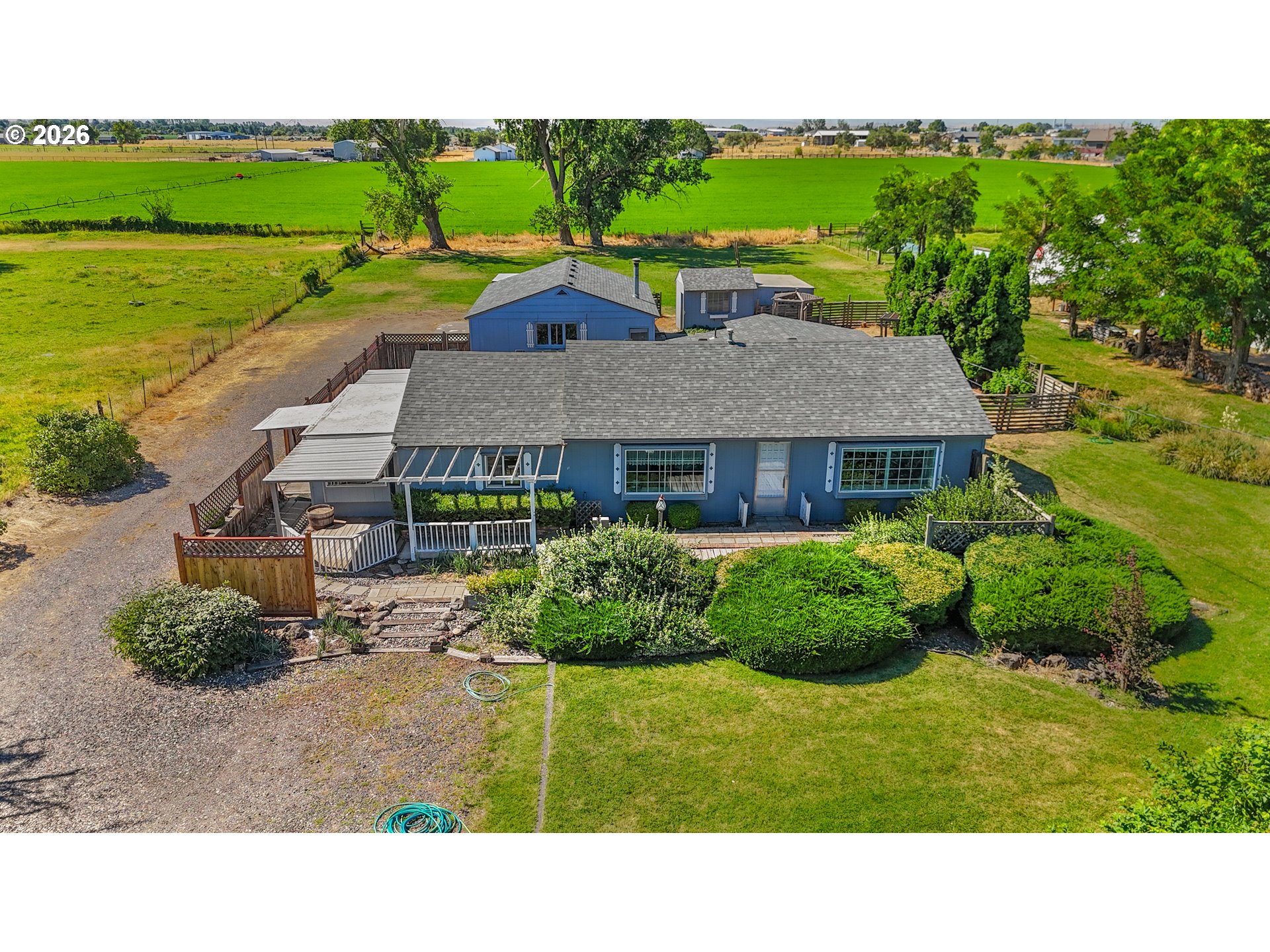 29538 Bridge Road Hermiston, OR 97838 - Photo 1 of 46 a aerial view of a house with garden space and lake view