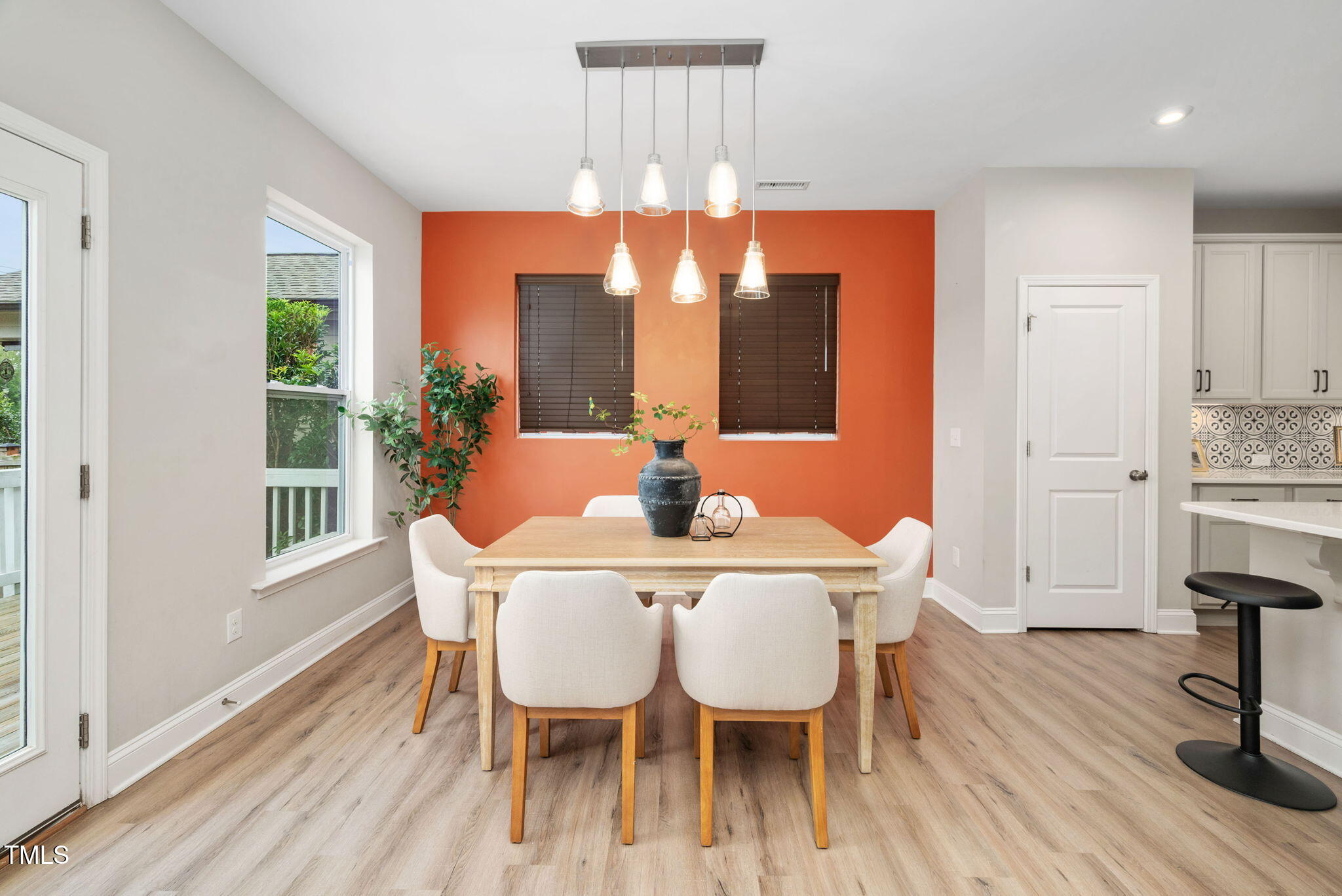 1821 Cypress Cove Drive Wendell, NC 27591 - Photo 10 of 31 a dining room with furniture a chandelier and wooden floor