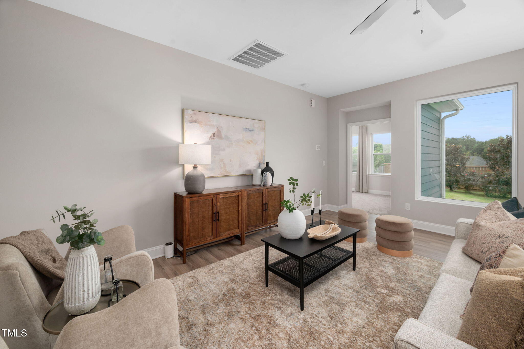 1821 Cypress Cove Drive Wendell, NC 27591 - Photo 13 of 31 a living room with furniture and a large window