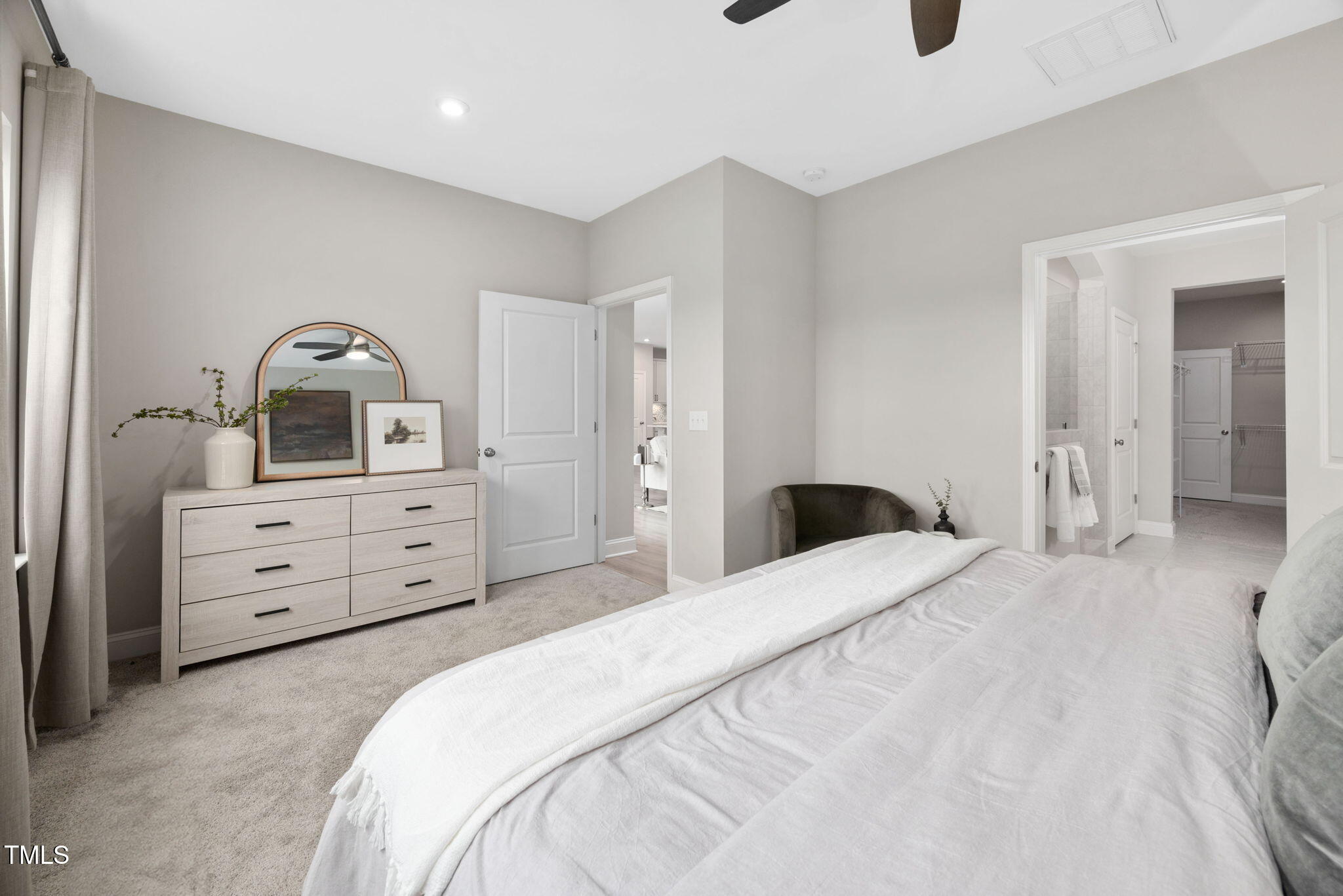 1821 Cypress Cove Drive Wendell, NC 27591 - Photo 15 of 31 a bedroom with a bed and a dresser