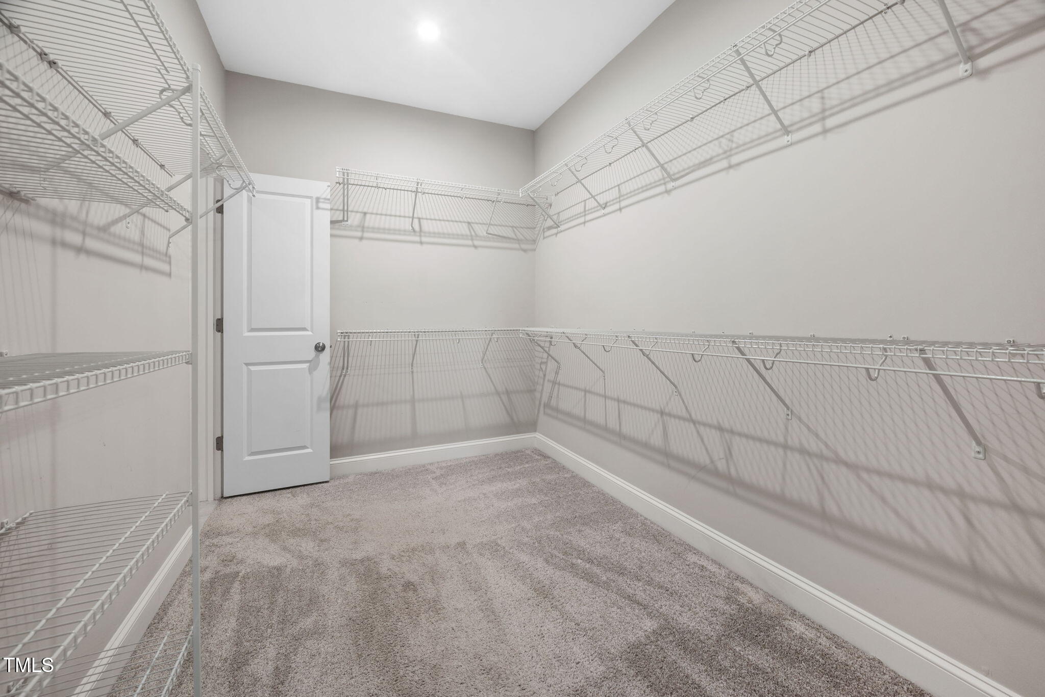 1821 Cypress Cove Drive Wendell, NC 27591 - Photo 18 of 31 a view of a room with racks on the wall