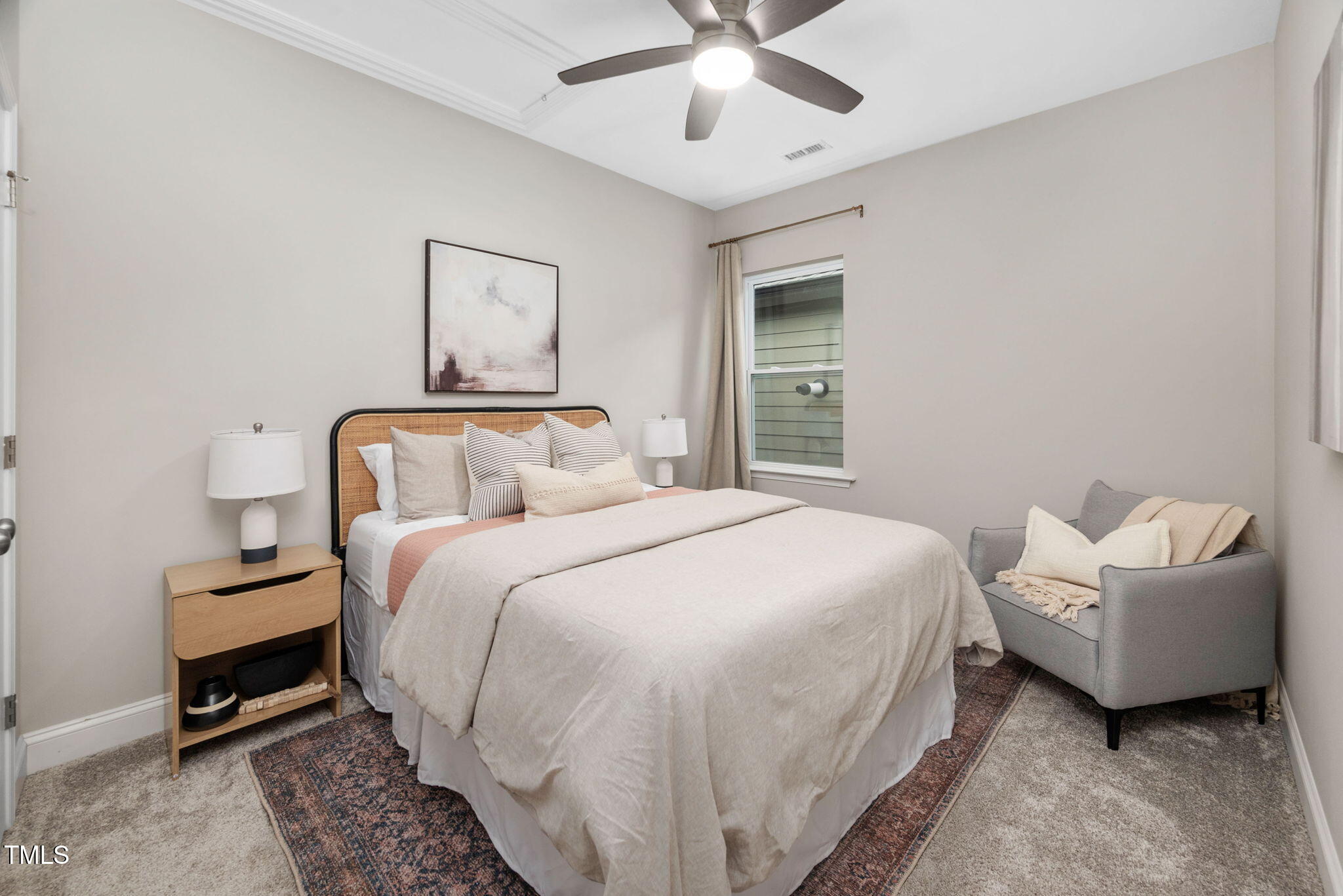 1821 Cypress Cove Drive Wendell, NC 27591 - Photo 21 of 31 a bedroom with a bed and a chandelier