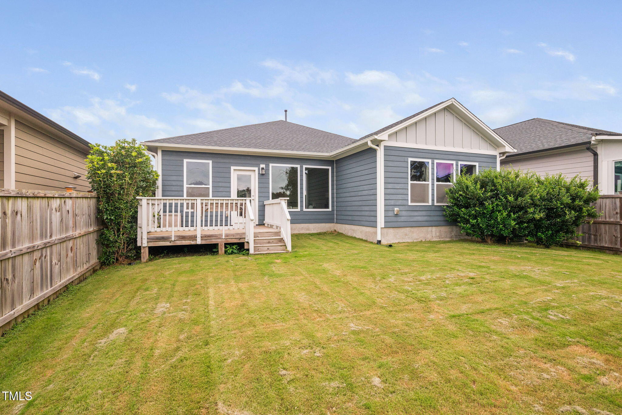 1821 Cypress Cove Drive Wendell, NC 27591 - Photo 28 of 31 a view of a house with wooden fence and a yard