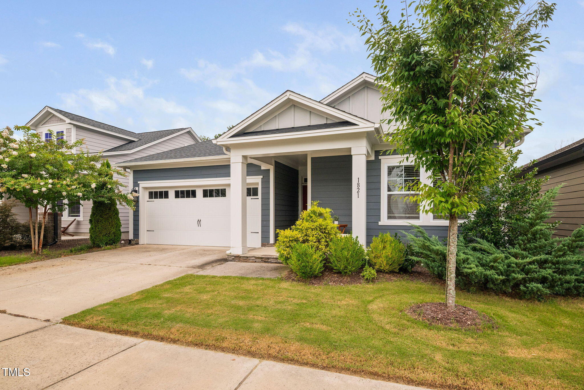 1821 Cypress Cove Drive Wendell, NC 27591 - Photo 3 of 31 a front view of a house with a yard and porch