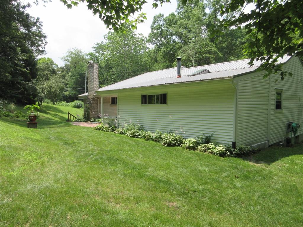 119 Shaffer Road Beaver Falls, PA 15010 - Photo 17 of 20 a front view of a house with a garden