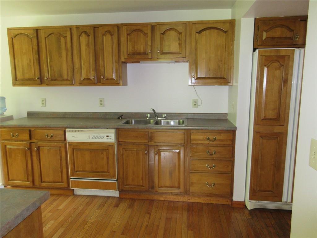 119 Shaffer Road Beaver Falls, PA 15010 - Photo 4 of 20 a bathroom with a granite countertop sink and a mirror