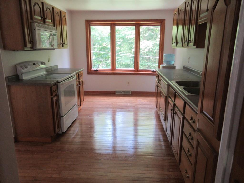 119 Shaffer Road Beaver Falls, PA 15010 - Photo 5 of 20 a kitchen with granite countertop a stove and a sink