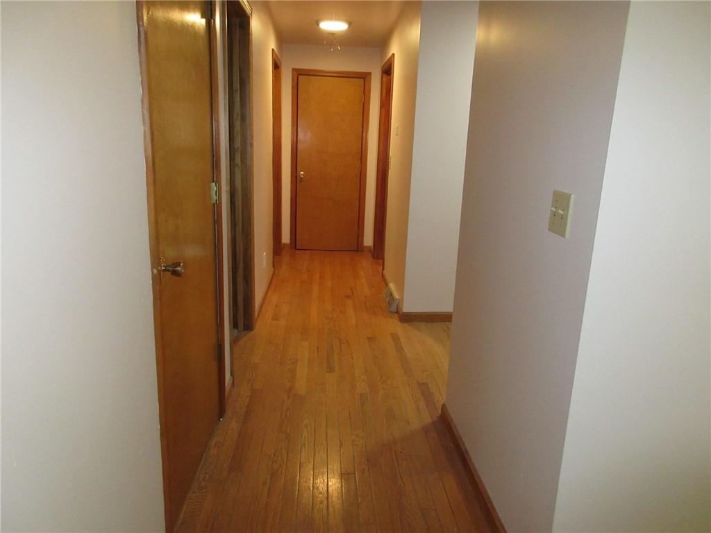119 Shaffer Road Beaver Falls, PA 15010 - Photo 7 of 20 a view of a hallway with wooden floor