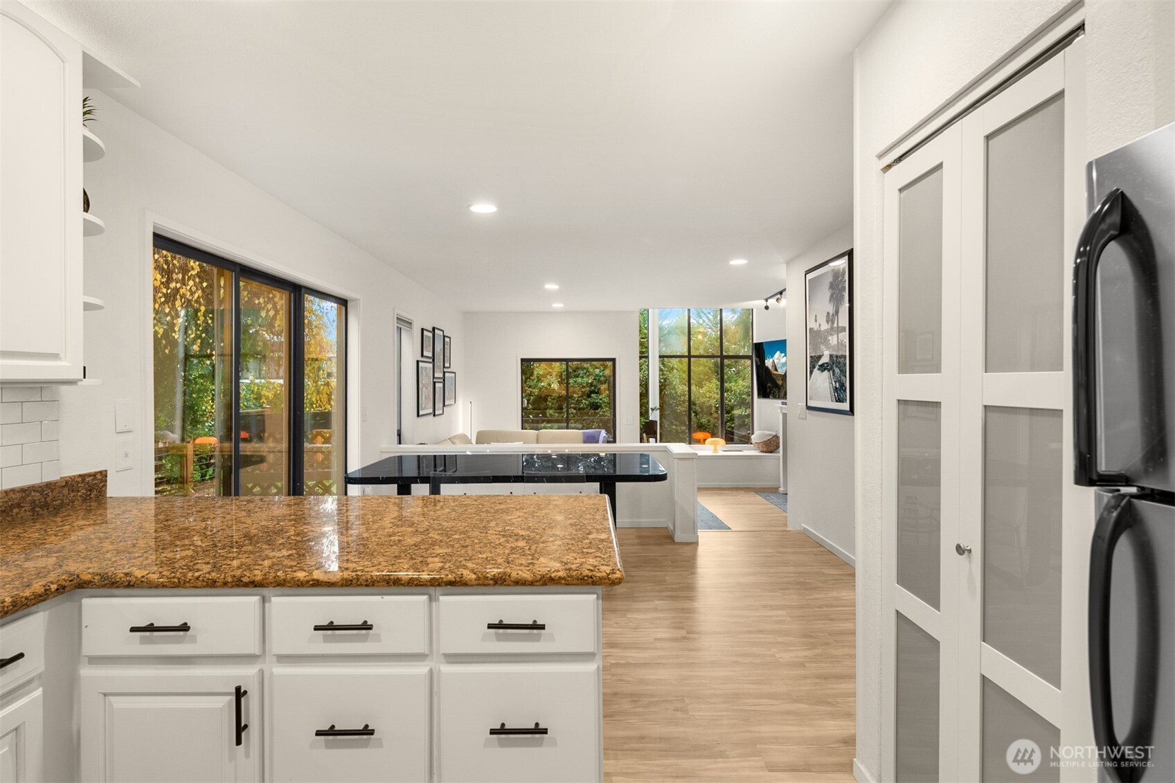 12 18th Avenue, Unit A Kirkland, WA 98033 - Photo 15 of 29 a view of living room with granite countertop kitchen view and large window