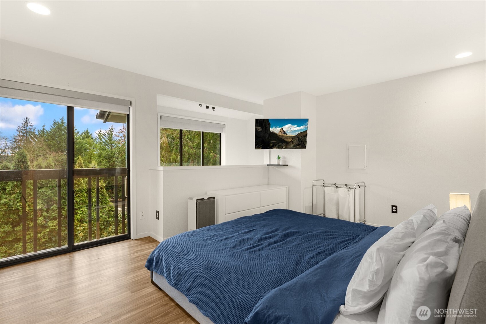 12 18th Avenue, Unit A Kirkland, WA 98033 - Photo 18 of 29 a bedroom with a bed and a flat tv screen next to a window