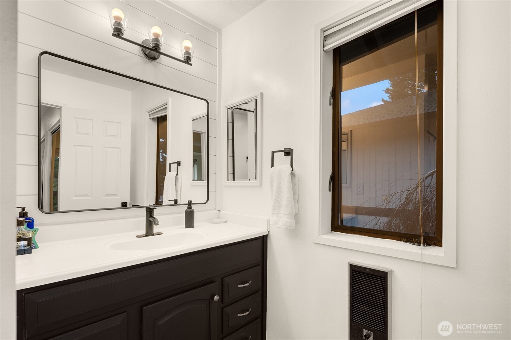 12 18th Avenue, Unit A Kirkland, WA 98033 - Photo 22 of 29 a bathroom with a sink double vanity and a mirror