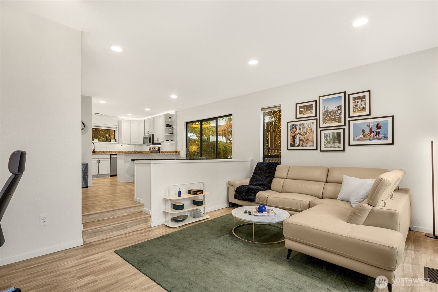 12 18th Avenue, Unit A Kirkland, WA 98033 - Photo 3 of 29 a living room with furniture and kitchen view