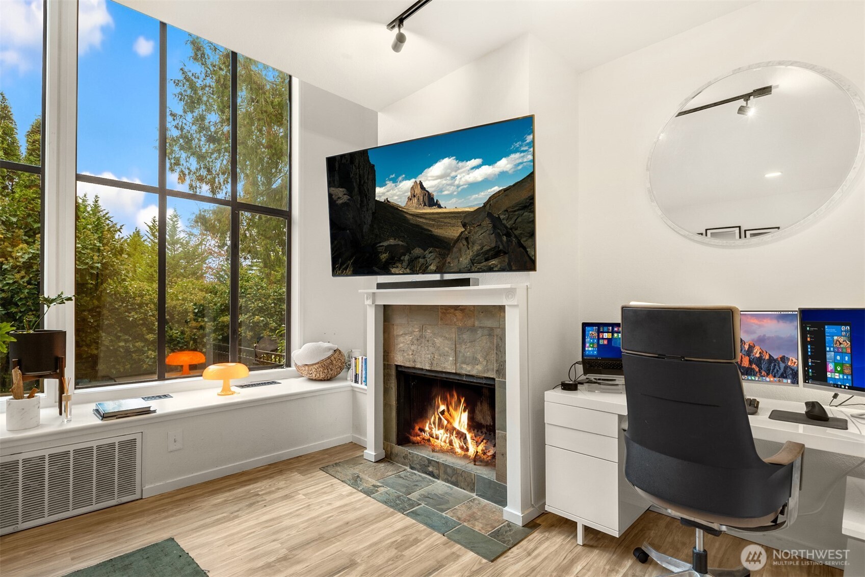 12 18th Avenue, Unit A Kirkland, WA 98033 - Photo 4 of 29 a living room with furniture a flat screen tv and a fireplace