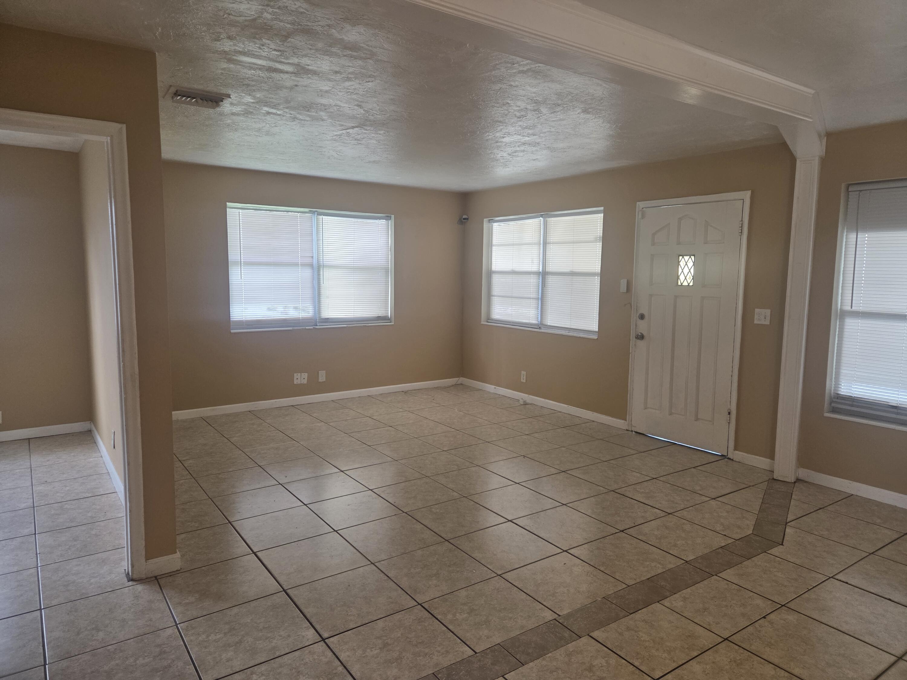 1509 Pine Tree Court Riviera Beach, FL 33404 - Photo 4 of 17 a view of an empty room and window