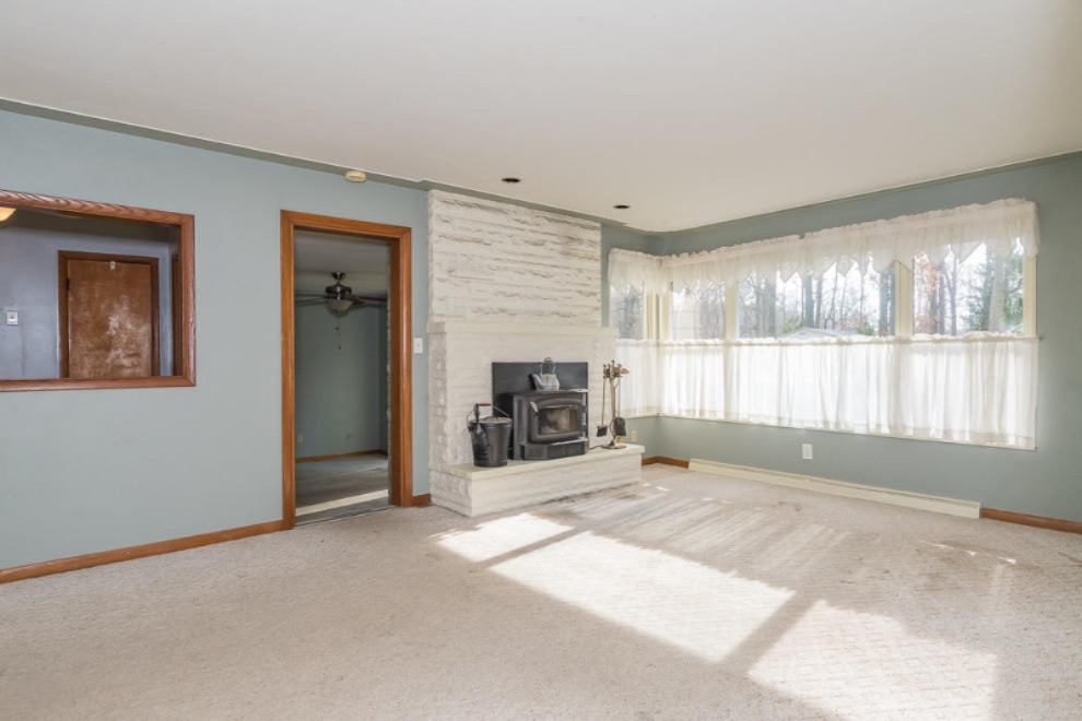 4330 Watkins Road Battle Creek, MI 49015 - Photo 34 of 56 living roomw fp, note windows