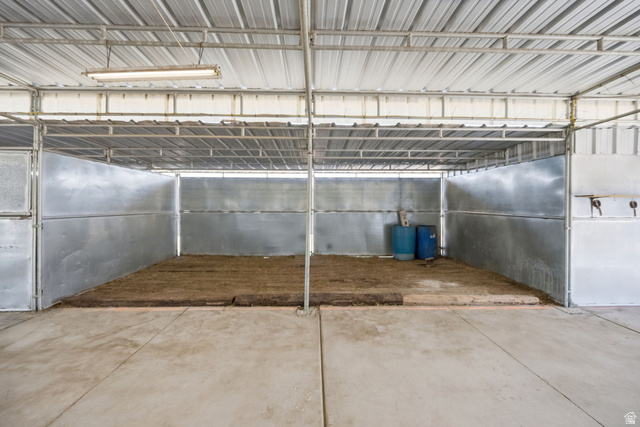 3732 Campbell Road Tooele, UT 84074 - Photo 58 of 69 Metal framed barn structure with a corrugated metal roof and concrete flooring