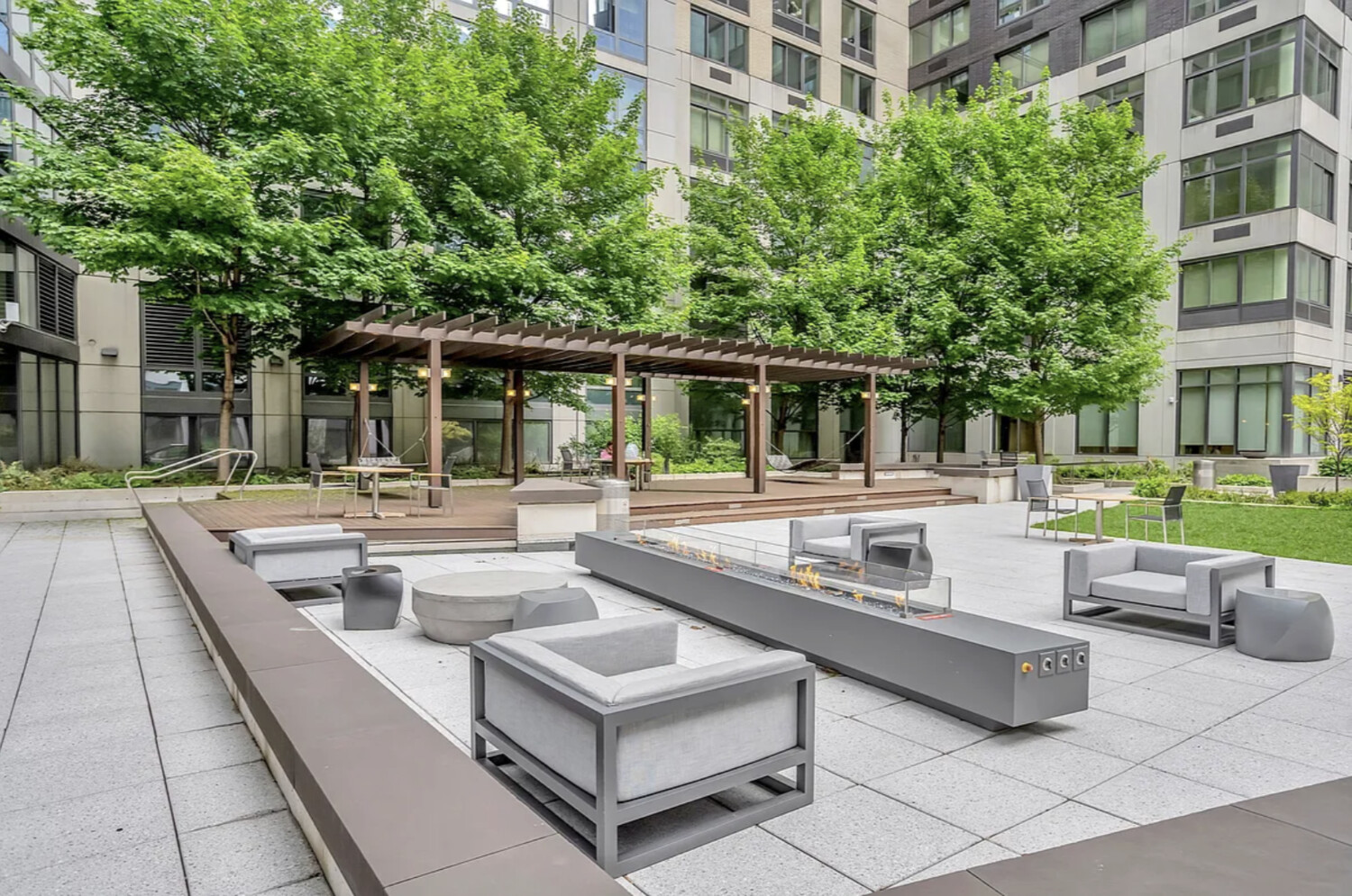 60 Riverside Boulevard, Unit 2011 Manhattan, NY 10069 - Photo 8 of 16 a view of a building with a swimming pool and sitting area
