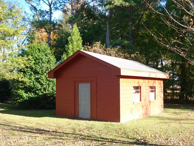 a backyard of a house with lots of green space