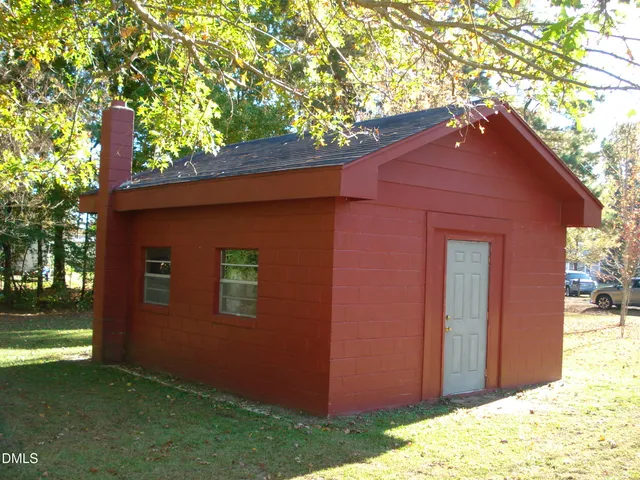 a view of a swimming pool with a large trees