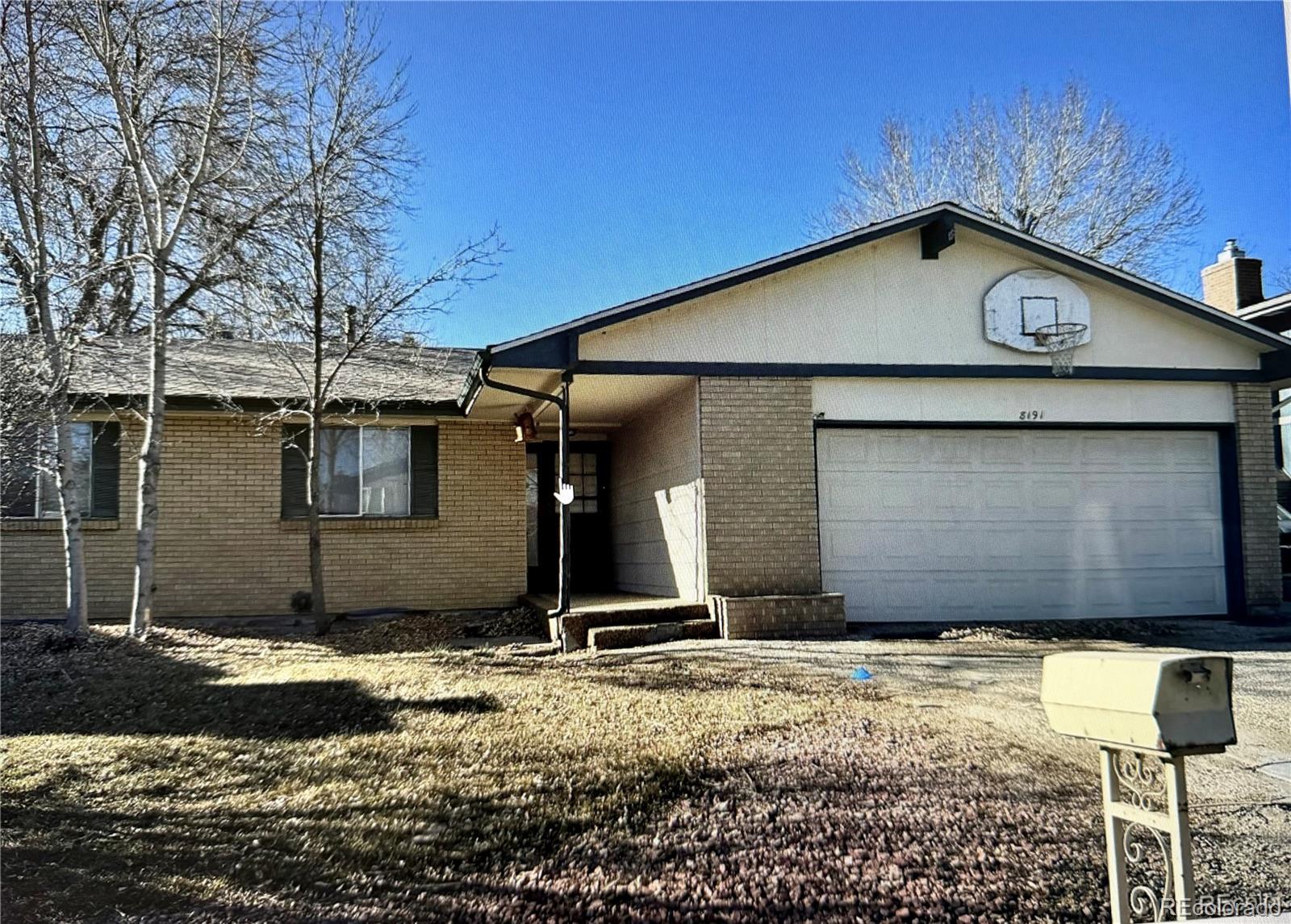 8191 Everett Way Arvada, CO 80005 - Photo 1 of 18 a view of a garage