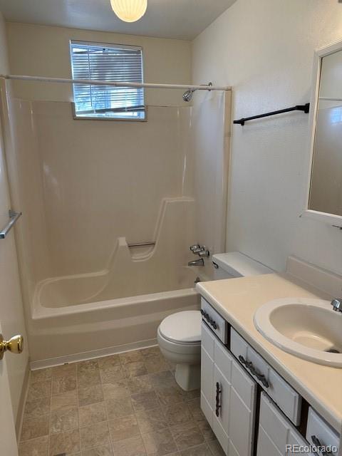 8191 Everett Way Arvada, CO 80005 - Photo 7 of 18 a bathroom with a sink a toilet and shower