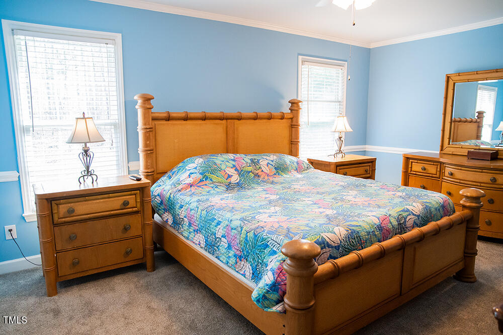 46 Beaver Crossing Road Roxboro, NC 27574 - Photo 18 of 50 a bed sitting in a bedroom next to a window
