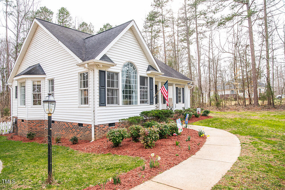 46 Beaver Crossing Road Roxboro, NC 27574 - Photo 2 of 50 a front view of a house with a yard