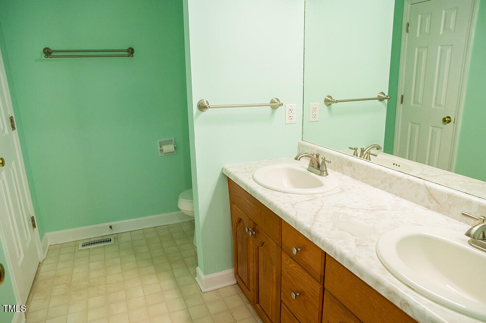 46 Beaver Crossing Road Roxboro, NC 27574 - Photo 23 of 50 a bathroom with a sink and a mirror